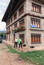 Jakar, Bumthang, Bhutan - September 14, 2016: Two tourist women standing at the corner of a building in Jakar, Bumthang, Bhutan.