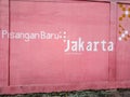 Jakarta is a city of collaboration, a wall in Pisangan Baru, East Jakarta. Royalty Free Stock Photo