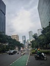 Jakarta city highway which is still cool with lots of trees on the sides