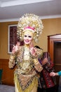 Portrait of beautiful young Asian muslim woman wearing traditional Minangkabau ethnic traditional dress prepared for wedding cerem