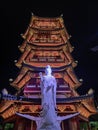 Jakarta, Indonesia _ 2 April 2023 . a white statue stands in front of a building called pagoda