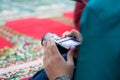 Professional wedding photographer looking through LCD screen of digital camera composing before taking pictures Royalty Free Stock Photo