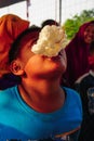 Jakarta, Indonesia - August 17, 2018: Little child are following the race eating crackers in Indonesia's independence day