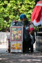 Jakarta, Indonesia - August 26, 2020: A man selling the fruit salad at sidewalk in Jakarta.