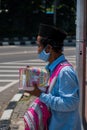 Jakarta, Indonesia - August 26, 2020: Portrait of old man is selling islamic book at the street of Jakarta.