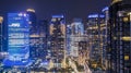 FWD office building with modern skyscrapers at night