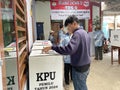 Indonesian election, inserting voting cards into the ballot box Royalty Free Stock Photo