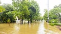 Flooded residence in Jakarta with kids bicycling