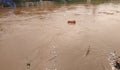 Jakarta, Jakarta / Indonesia - January 1th 2020: rubbish carried by flood water flow Royalty Free Stock Photo