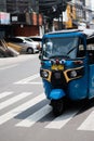 Jakarta, Indonesia - July 23, 2020: The Bajaj`s driver is calling the passenger to ride.