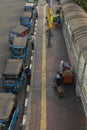 A long line of tuk tuk waiting for new customers in Dr Sutomo Street.