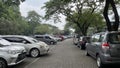 Rows of visitors\' cars in the parking area of Ragunan Zoo