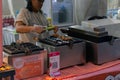 Jakarta, Indonesia â July 7, 2023: Takoyaki being prepared at a foodstall by chef