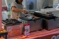 Jakarta, Indonesia â July 7, 2023: Takoyaki being prepared at a foodstall by chef