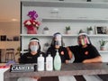 Jakarta, Indonesia - 7 June 2020: Preparation of new normal cafe employees using face shields and masks