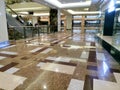 Jakarta, Indonesia Ã¢â¬â March 20, 2022: Empty hallway with marble floor in modern shopping mall