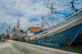 JAKARTA, INDONESIA - 5 MARCH, 2017: Inside famous old port area of Jakarta, fishing boats lying at harbor, fishermen