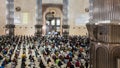 Jakarta, Indonesia - March 11, 2022: Muslims pray Friday in congregation at the Istiqlal Mosque, keeping their distance