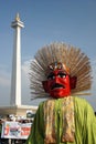 Ondel-ondel in front of Monas Monument, Jakarta. Royalty Free Stock Photo