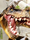 Jakarta, Indonesia Ã¢â¬â March 20, 2022: A scary face dinosaur puppet with sharp teeth at toy store