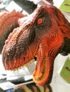 Jakarta, Indonesia Ã¢â¬â March 20, 2022: A scary face dinosaur puppet with sharp teeth at toy store