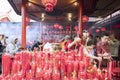 Buddha devotees burning incense sticks to pray