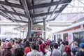 Crowded people waiting commuter train arrival