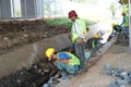 construction workers repairing water pipes