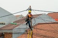 PLN workers repairing the electricity