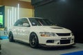 White Mitsubishi Lancer Evolution IX sedan in Indonesia Modification Expo 2023