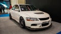 White Mitsubishi Lancer Evolution IX sedan in Indonesia Modification Expo 2023