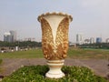 Jakarta, July 30-2023 :Giant flower vase with relief carving of a jatayu bird painted in gold color at Merdeka Park