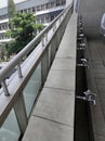 Jakarta, june 15th 2021, a row of faucets on the walls and handrails on the top of the building.