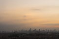 Jakarta landscape city from aerial view commercial skyscaper building with crowded residential houses on evening time sunset Royalty Free Stock Photo