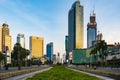 Jakarta skyline around HI Roundabout Bundaran HI, as viewed from MH Thamrin Street, at sunset.