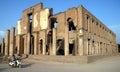 Jalalabad, Afghanistan: A man rides a motorbike in front of the Seraj-ul Emorat ruins