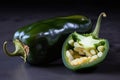 jalapeno half cut in half, with all of its spicy insides revealed