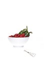 Jalapeno peppers and rose hips. Royalty Free Stock Photo