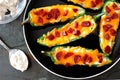 Jalapeno poppers with cheese and pepperoni overhead view