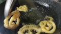 Jalebi, also known as Jilapi, zulbia, mushabak and zalabia, is an Indian and Arabic sweet being cooked in a home