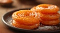 Jalebi coated in sugar syrup, traditional Indian sweet dish. Delicious oriental sweets. Concept of Indian cuisine