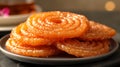 Jalebi coated in sugar syrup, traditional Indian sweet dish. Delicious oriental sweets. Concept of Indian cuisine