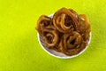 Jalebi Indian sweet dish on green background Royalty Free Stock Photo