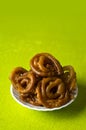 Jalebi Indian sweet dish on green background Royalty Free Stock Photo