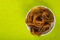 Jalebi Indian sweet dish on green background Royalty Free Stock Photo