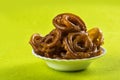 Jalebi Indian sweet dish on green background Royalty Free Stock Photo