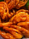 Jalebi is a popular Indian sweet snack in pretzel or circular shapes