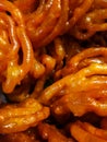 Jalebi is a popular Indian sweet snack in pretzel or circular shapes