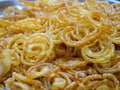 Crispy Sweet Jalebi, Jilapi, zulbia, mushabak or zalabia selling on street shop.