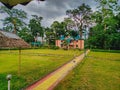 25.05.2022 jalpaiguri west bengal india, view of a resort with lawn near bank of river murti in jalpaiguri